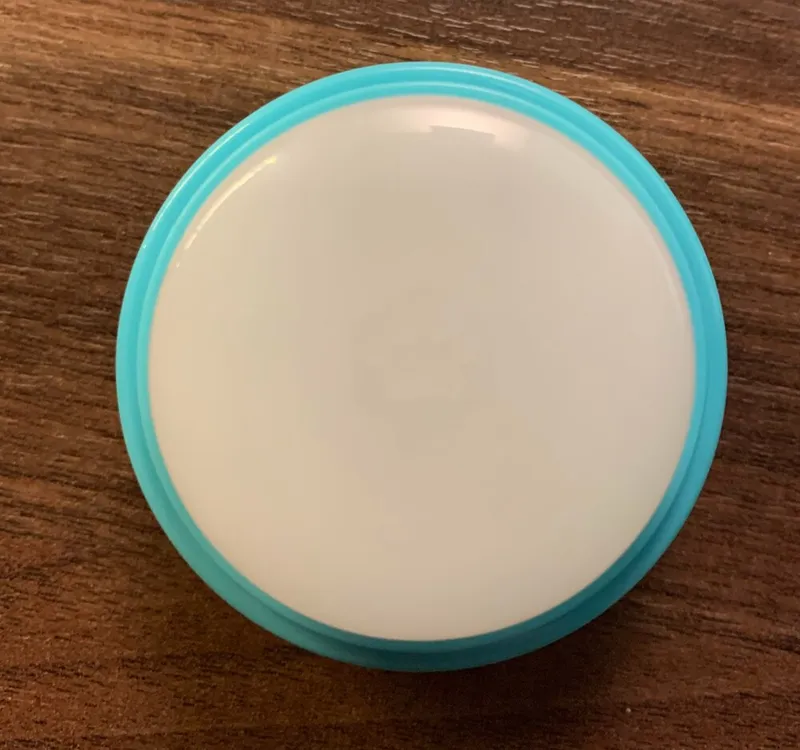 The white translucent top cap of a Connect Button.